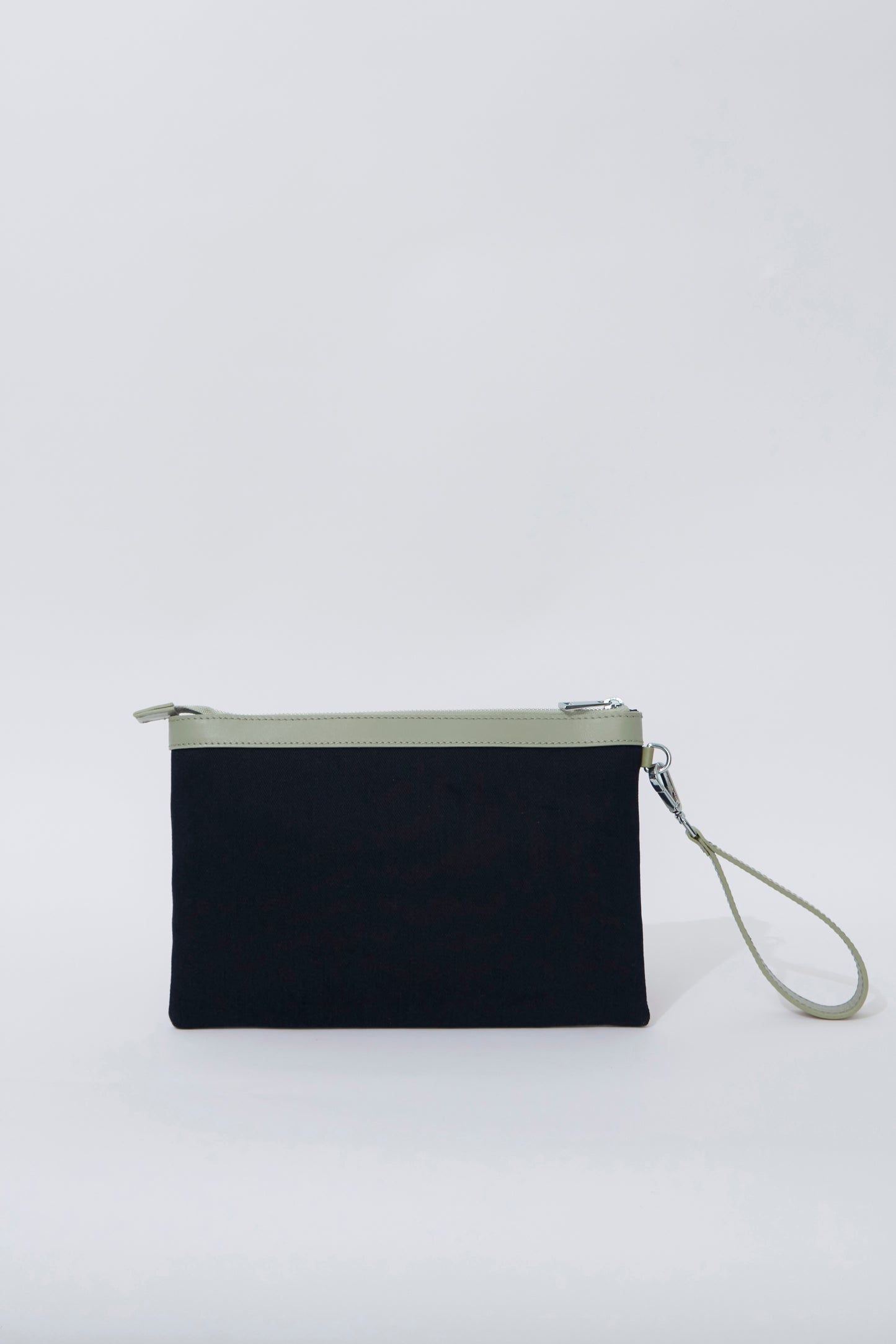 STITCHED CLUTCH IN NAVY AND OIL GREEN
