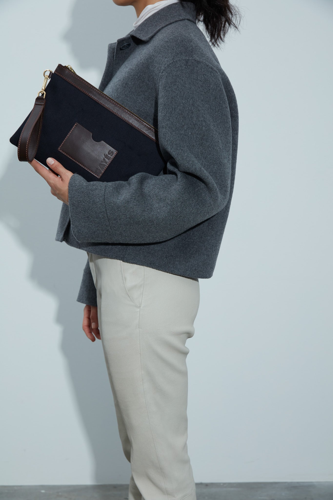 STITCHED CLUTCH IN NAVY AND BROWN