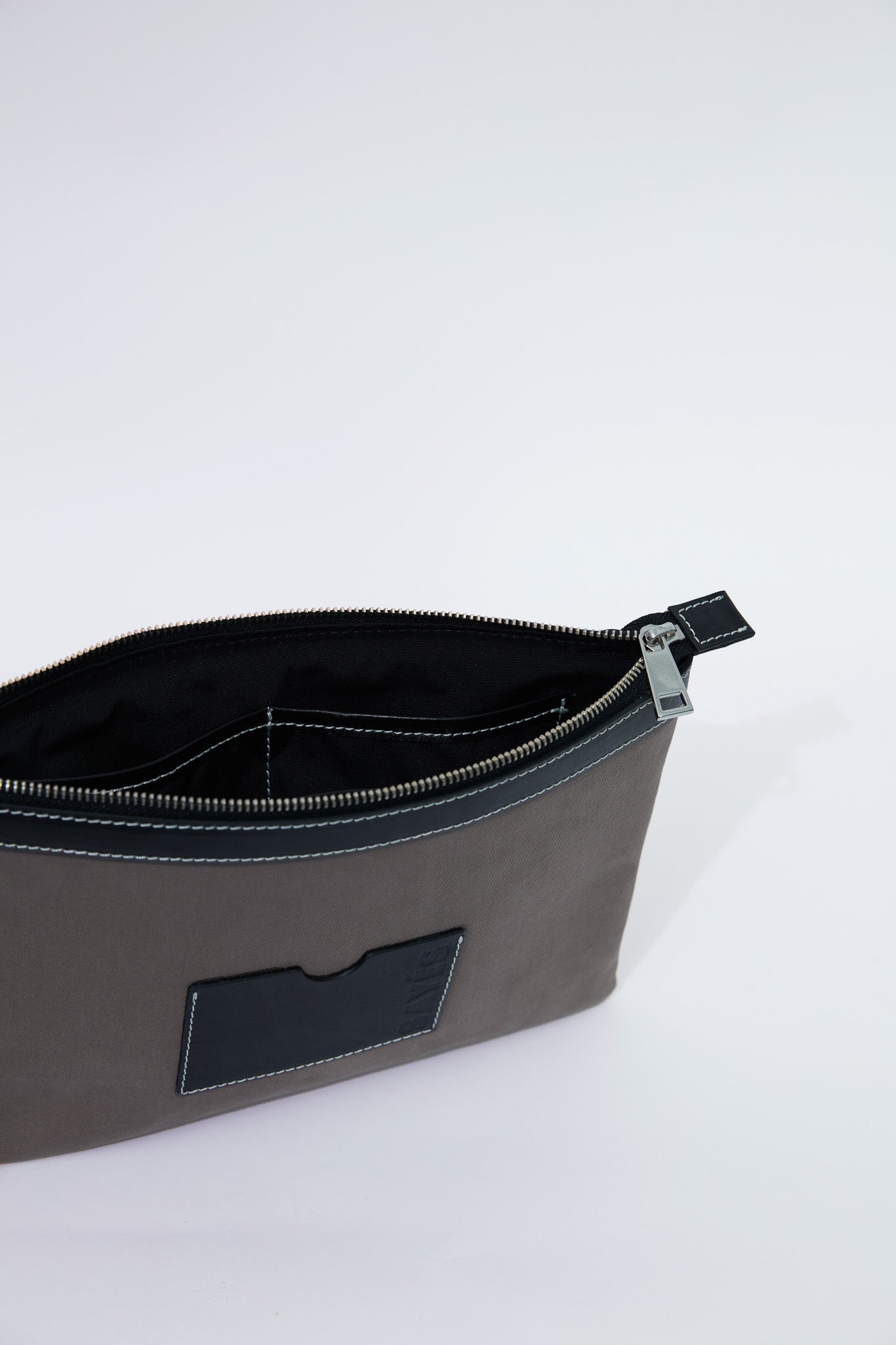 STITCHED CLUTCH IN MINK AND BLACK