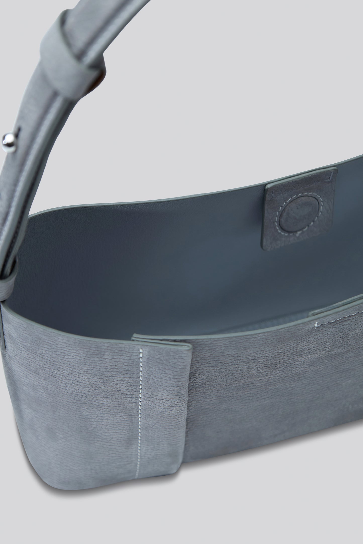 THE TOTE PLISSÉ EAST-WEST CEMENT NUBUCK