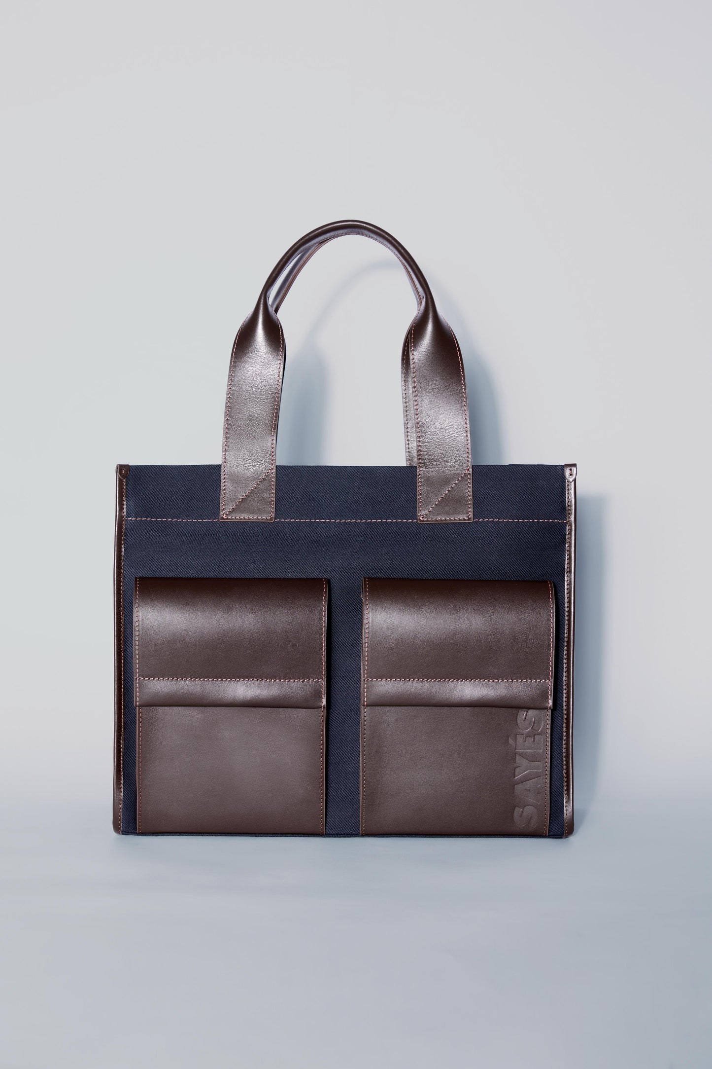 STITCHED POCKET MAXI TOTE IN NAVY AND BROWN