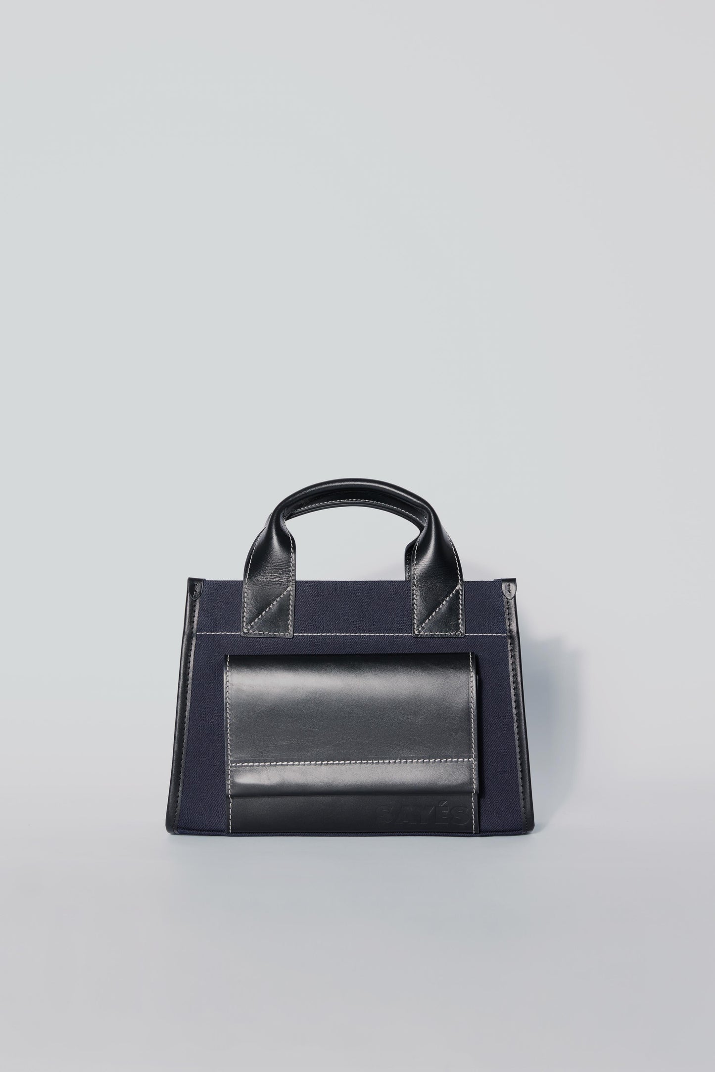 STITCHED POCKET MINI TOTE BAG IN NAVY AND BLACK