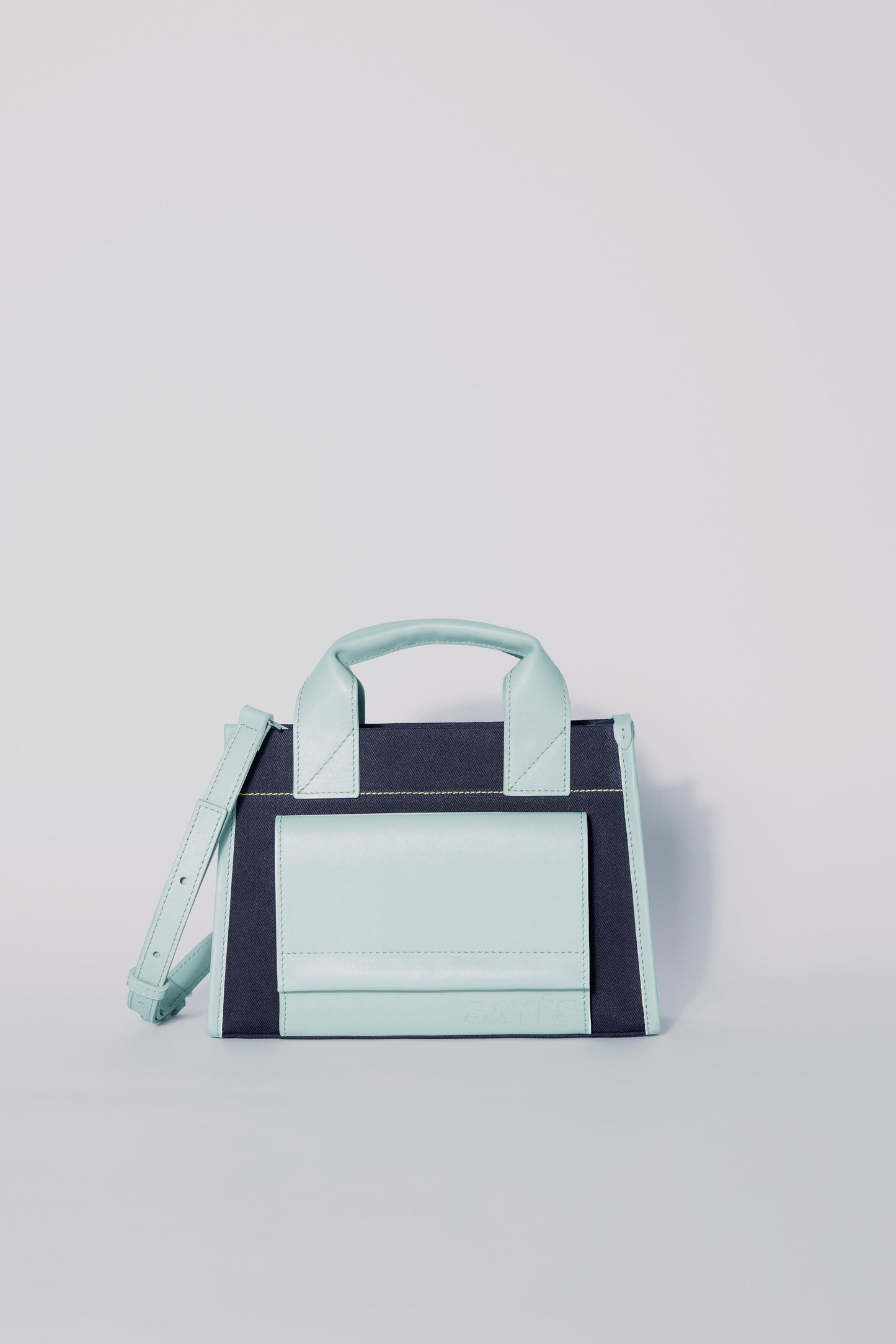 STITCHED POCKET MINI TOTE BAG IN NAVY AND SEA GREEN