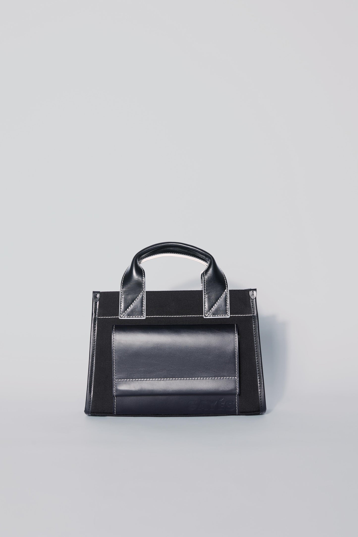 STITCHED POCKET MINI TOTE BAG IN BLACK WITH OFF-WHITE EDGES
