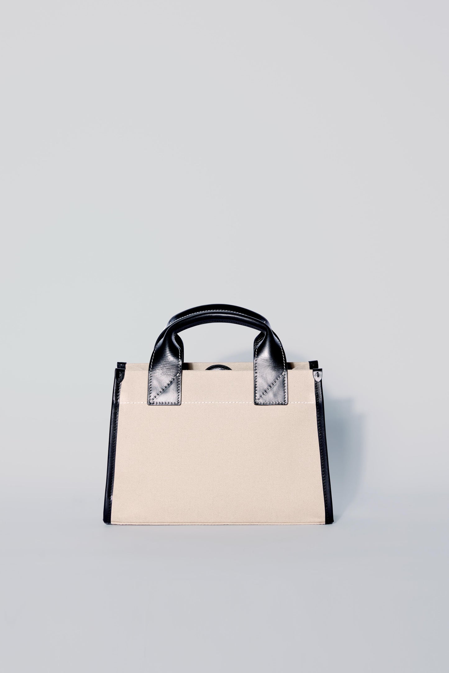 STITCHED POCKET MINI TOTE IN BEIGE AND BLACK