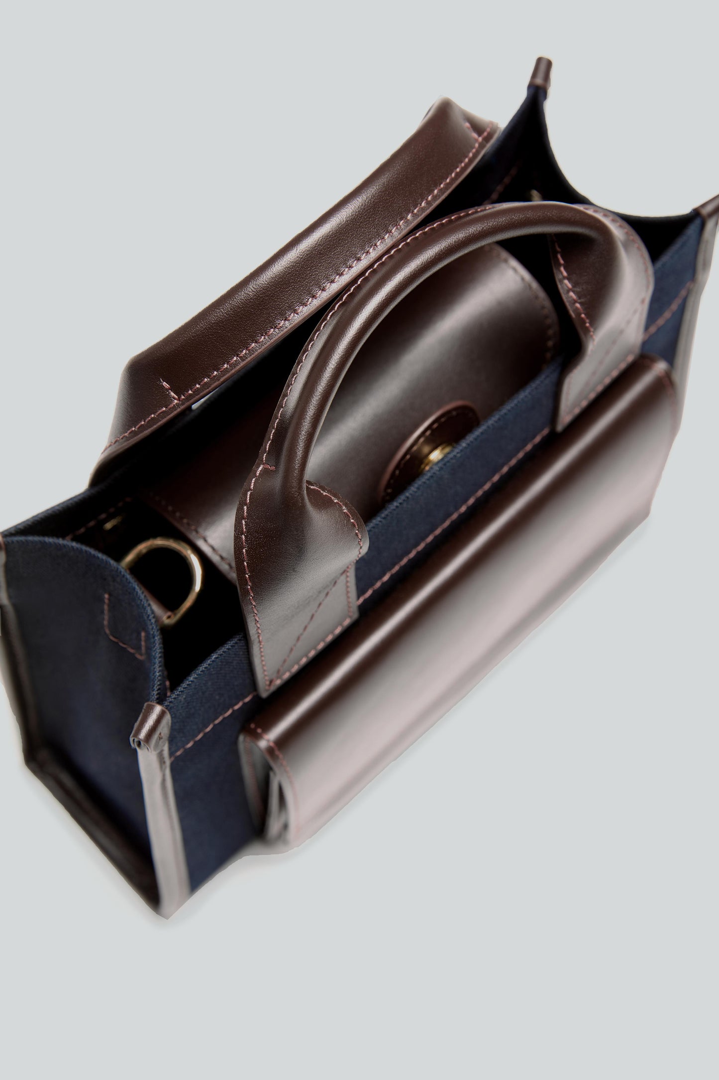 STITCHED POCKET MINI TOTE IN NAVY AND BROWN