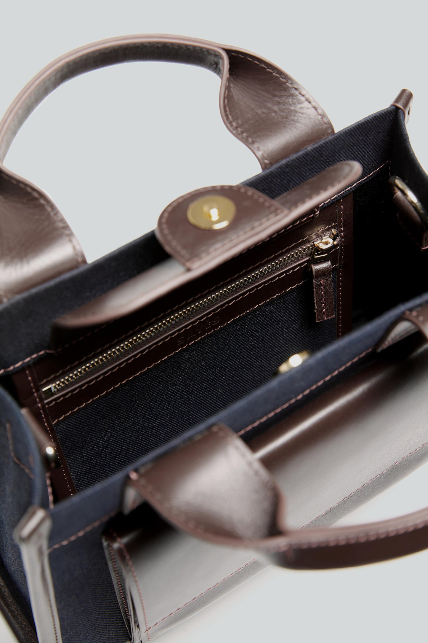 STITCHED POCKET MINI TOTE IN NAVY AND BROWN