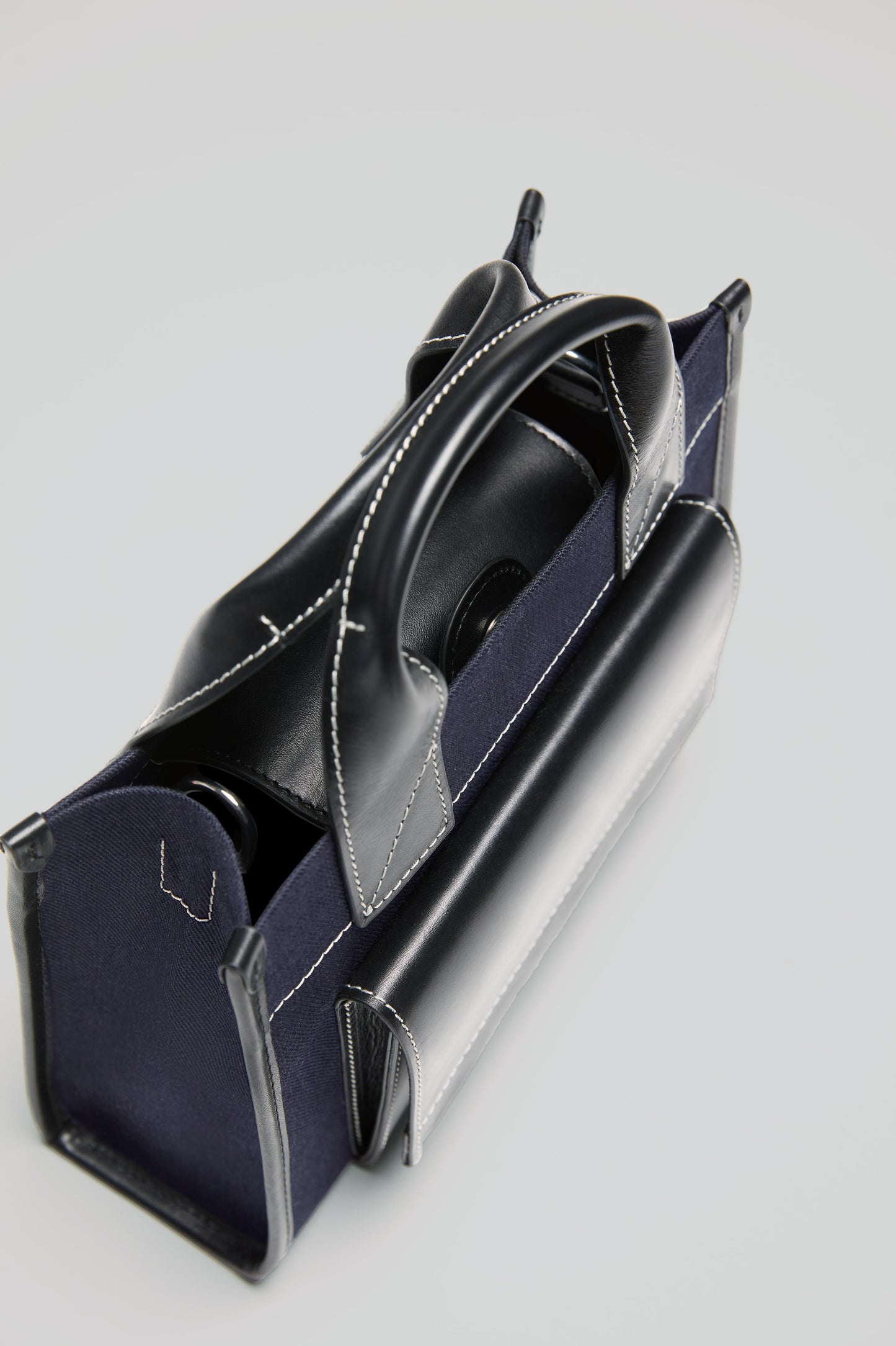 STITCHED POCKET MINI TOTE BAG IN NAVY AND BLACK