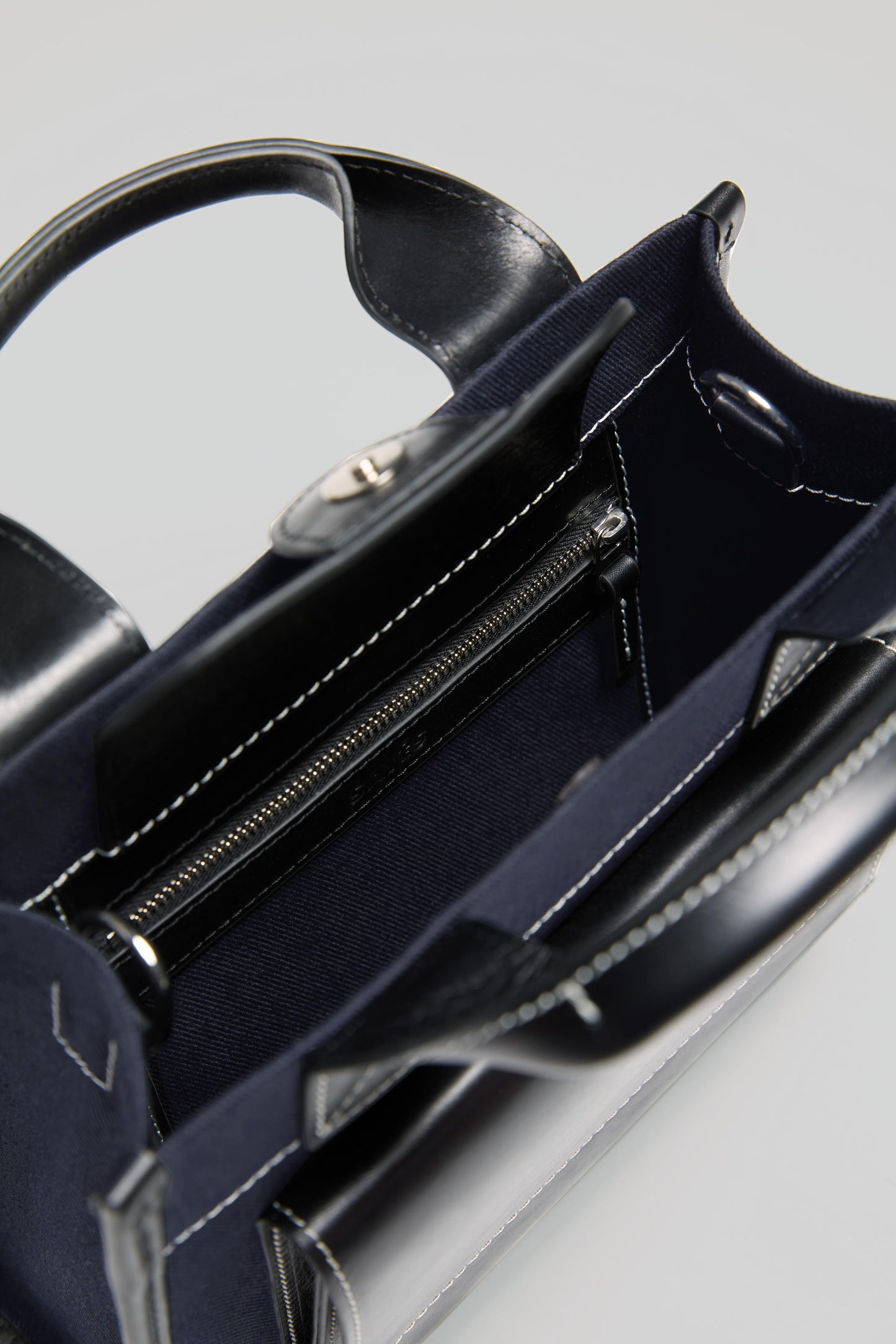 STITCHED POCKET MINI TOTE BAG IN NAVY AND BLACK