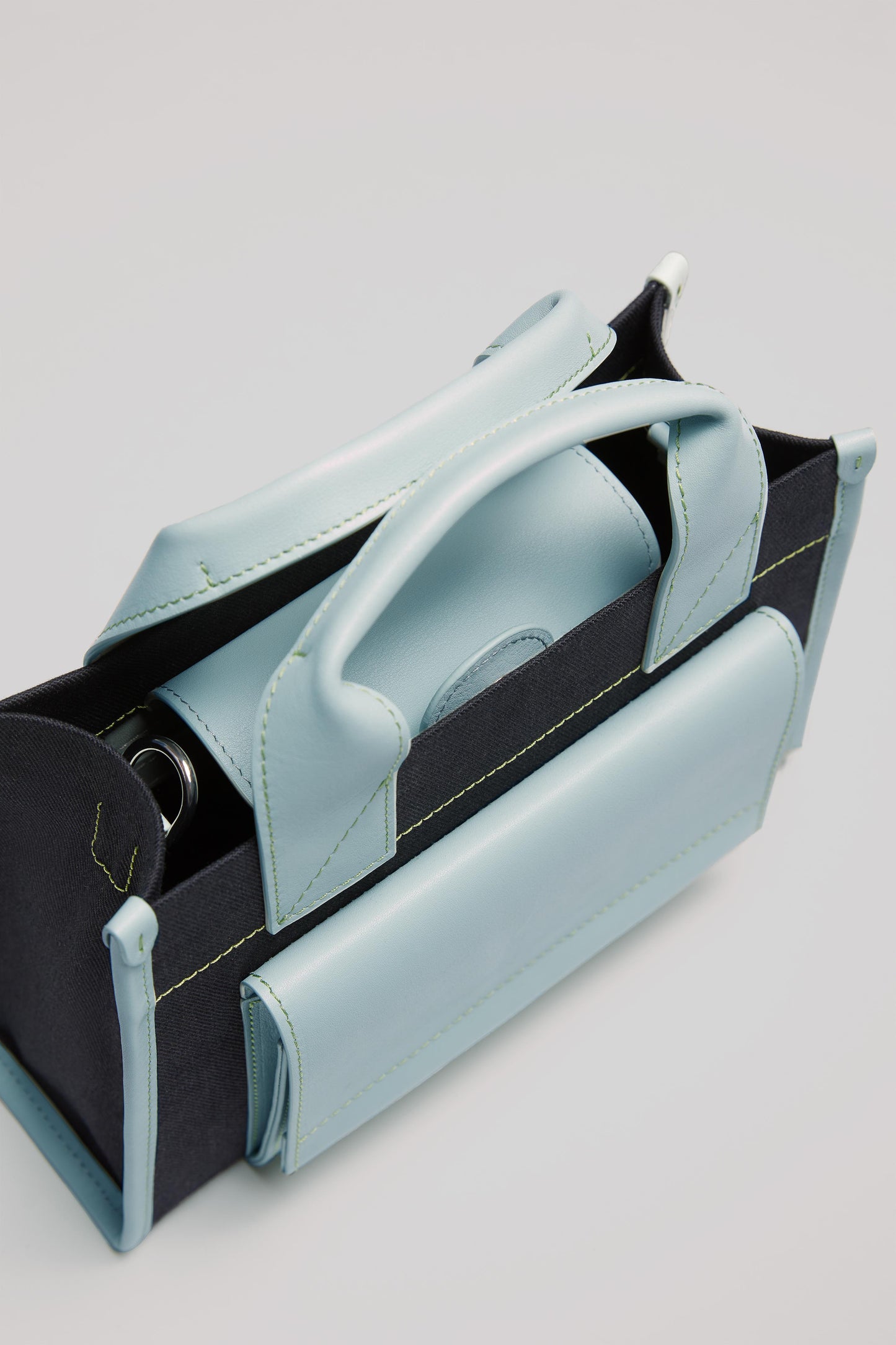 STITCHED POCKET MINI TOTE BAG IN NAVY AND SEA GREEN