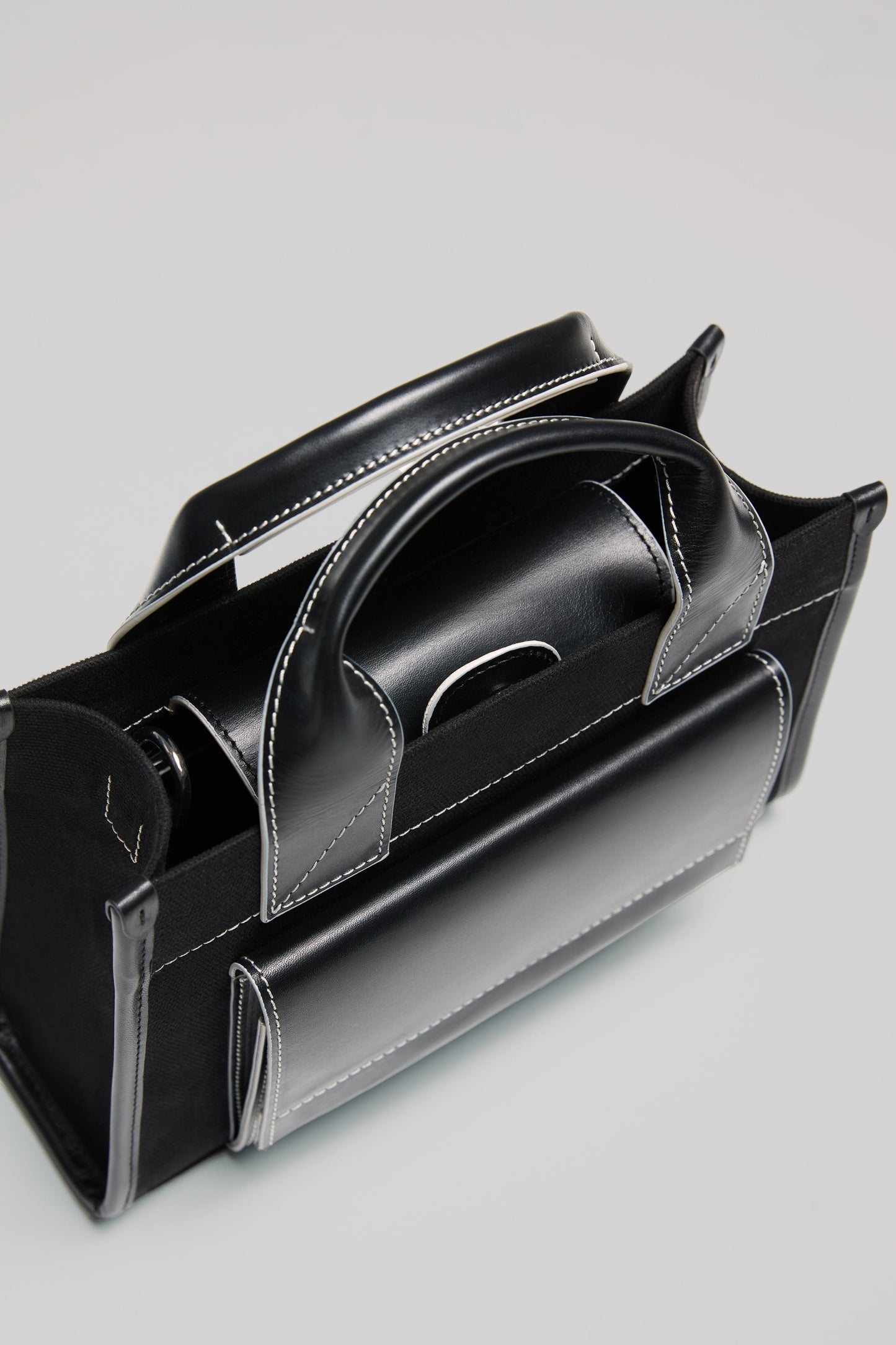 STITCHED POCKET MINI TOTE BAG IN BLACK WITH OFF-WHITE EDGES