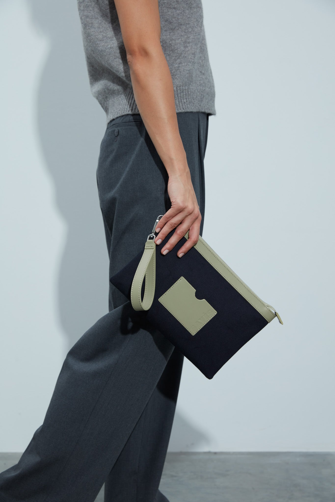 STITCHED CLUTCH BAG IN NAVY AND OIL GREEN
