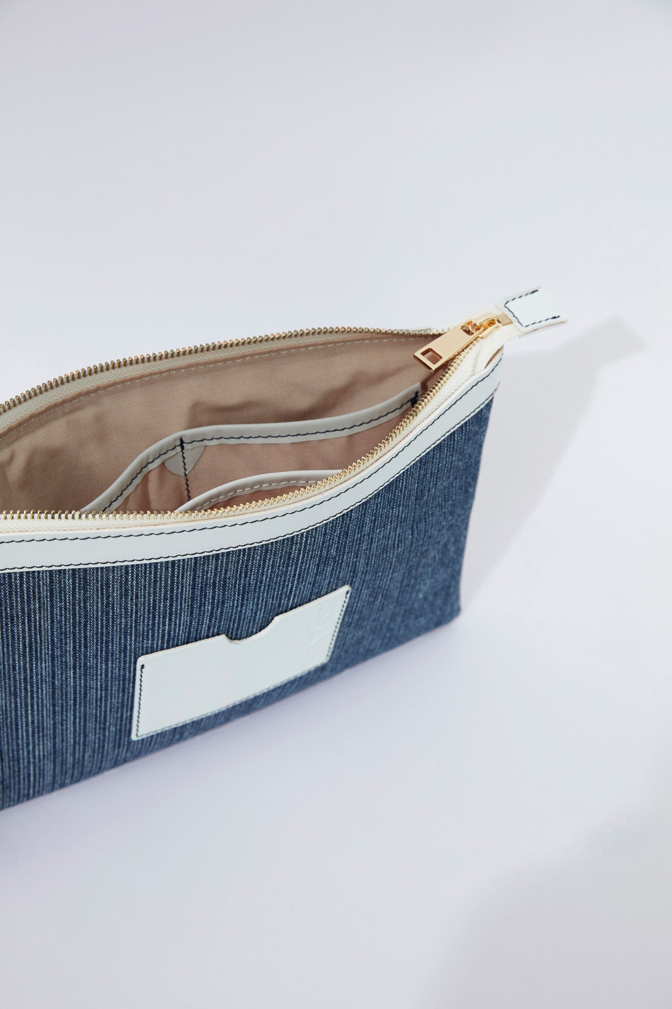 STITCHED CLUTCH BAG IN MARINE AND OFF-WHITE