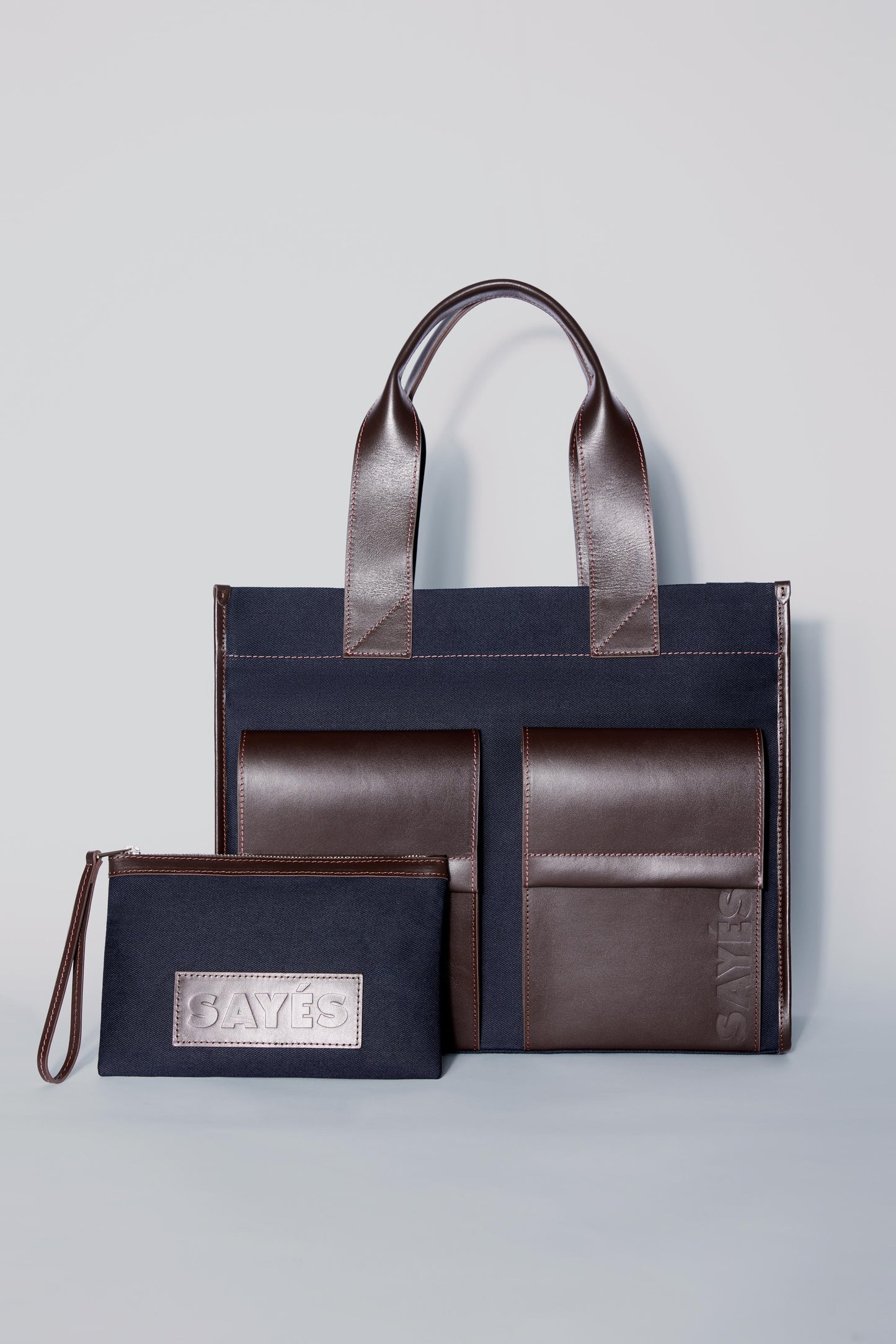 STITCHED POCKET MAXI TOTE BAG IN NAVY AND BROWN