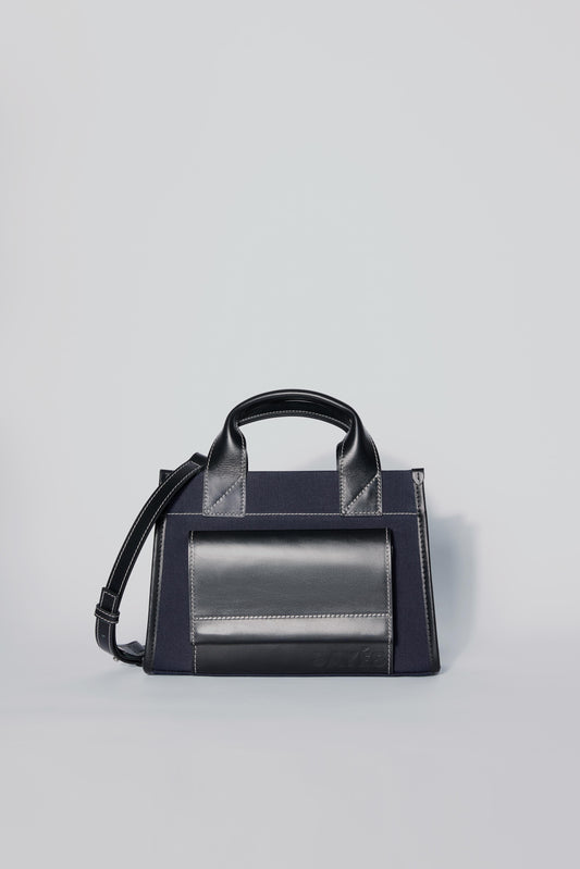 STITCHED POCKET MINI TOTE IN NAVY AND BLACK