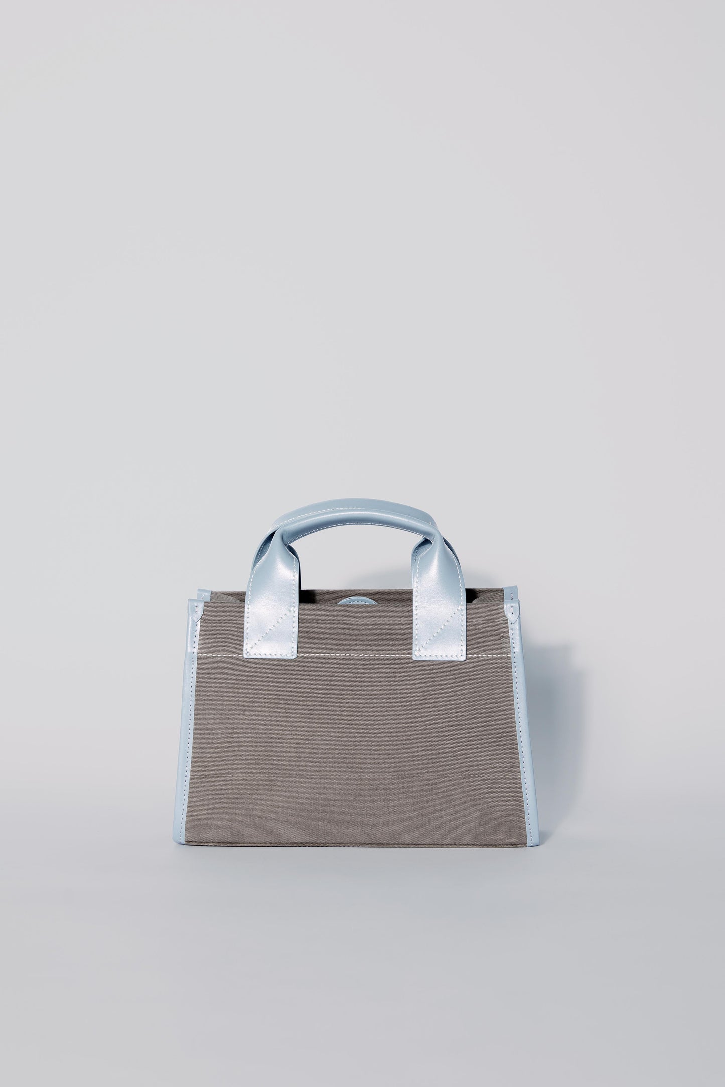 STITCHED POCKET MINI TOTE BAG IN MINK AND BLUE
