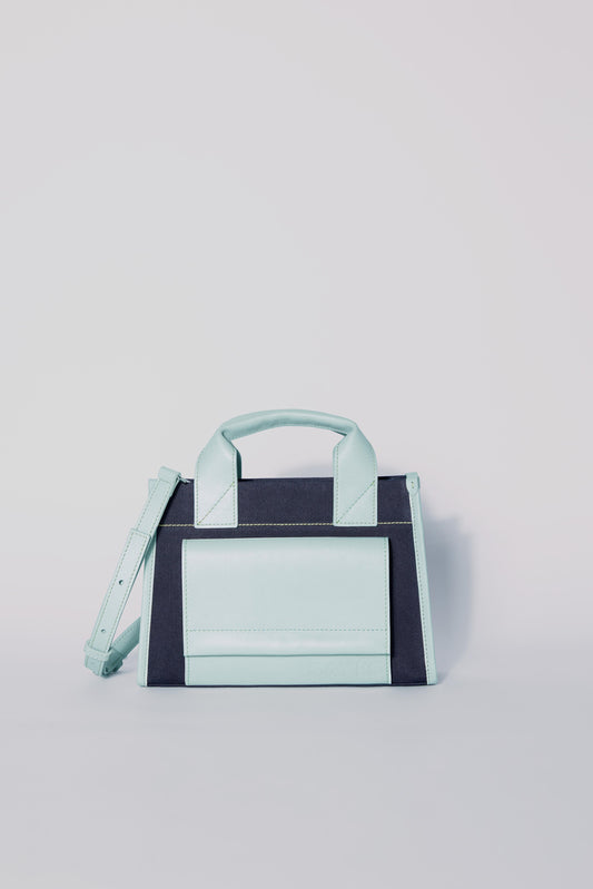 STITCHED POCKET MINI TOTE IN NAVY AND SEA GREEN