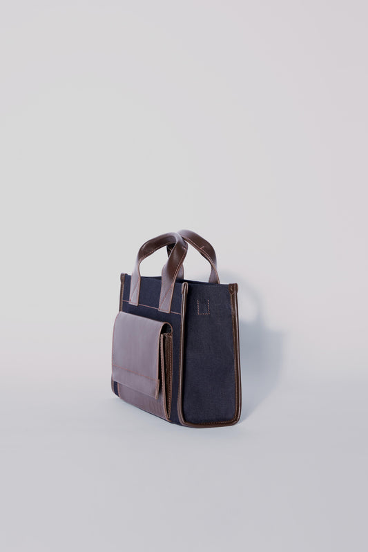 STITCHED POCKET MINI TOTE BAG IN NAVY AND BROWN