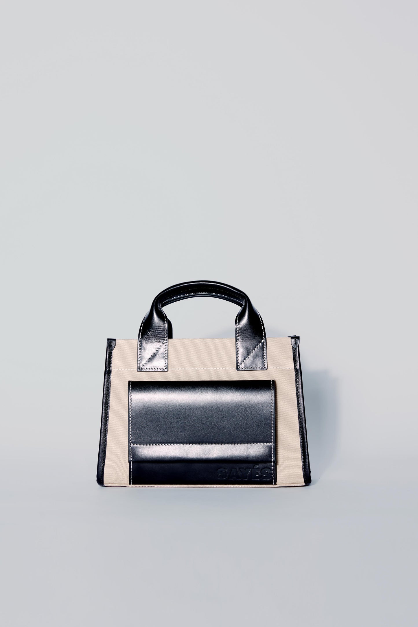 STITCHED POCKET MINI TOTE IN BEIGE AND BLACK