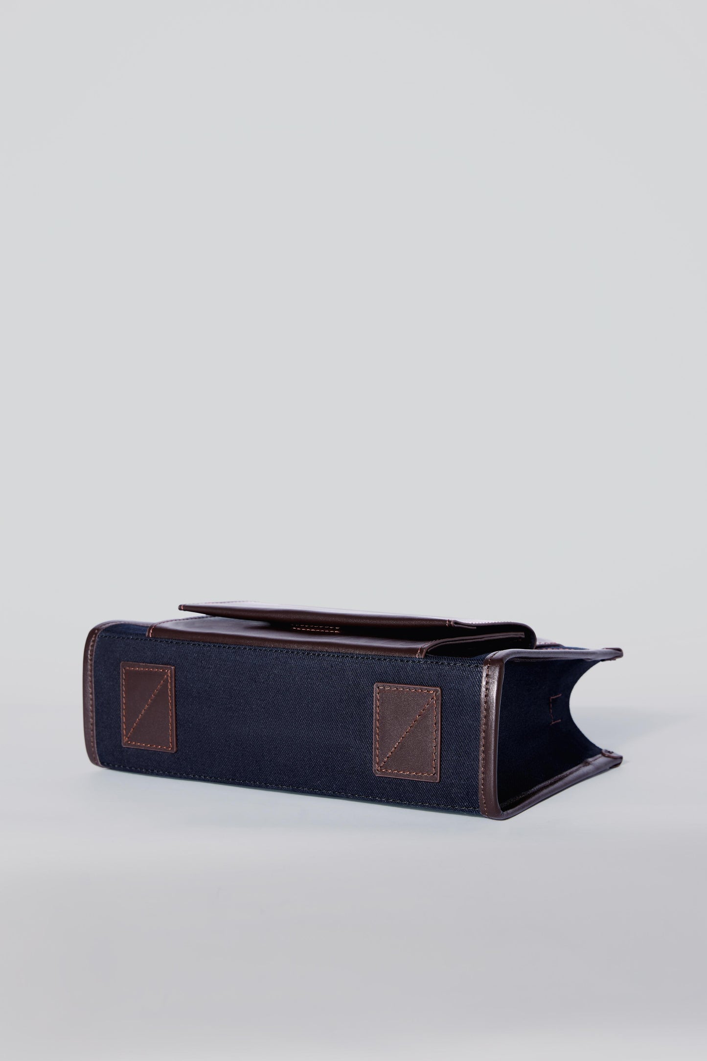 STITCHED POCKET MINI TOTE IN NAVY AND BROWN